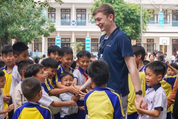 Children of Vietnam supporting water filtration systems and bicycles in Quảng Ngãi province